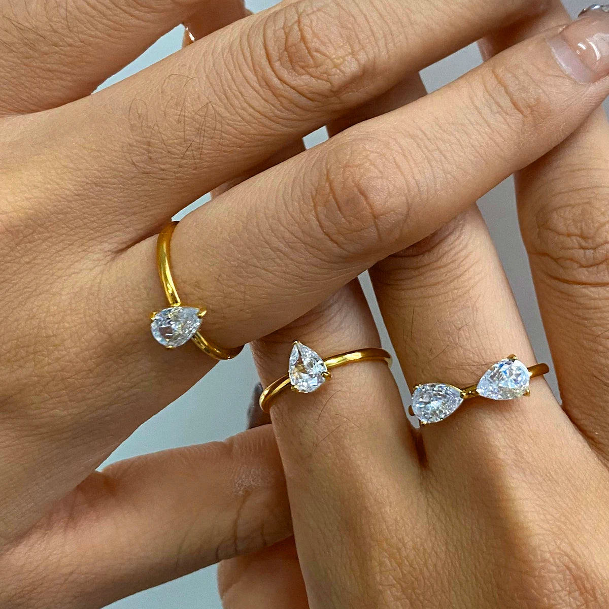 Minimalist 3-Piece Ring Set . Stainless Steel Stackable Rings with Zircon Accents and Ribbed Flower Detail for Effortless Style