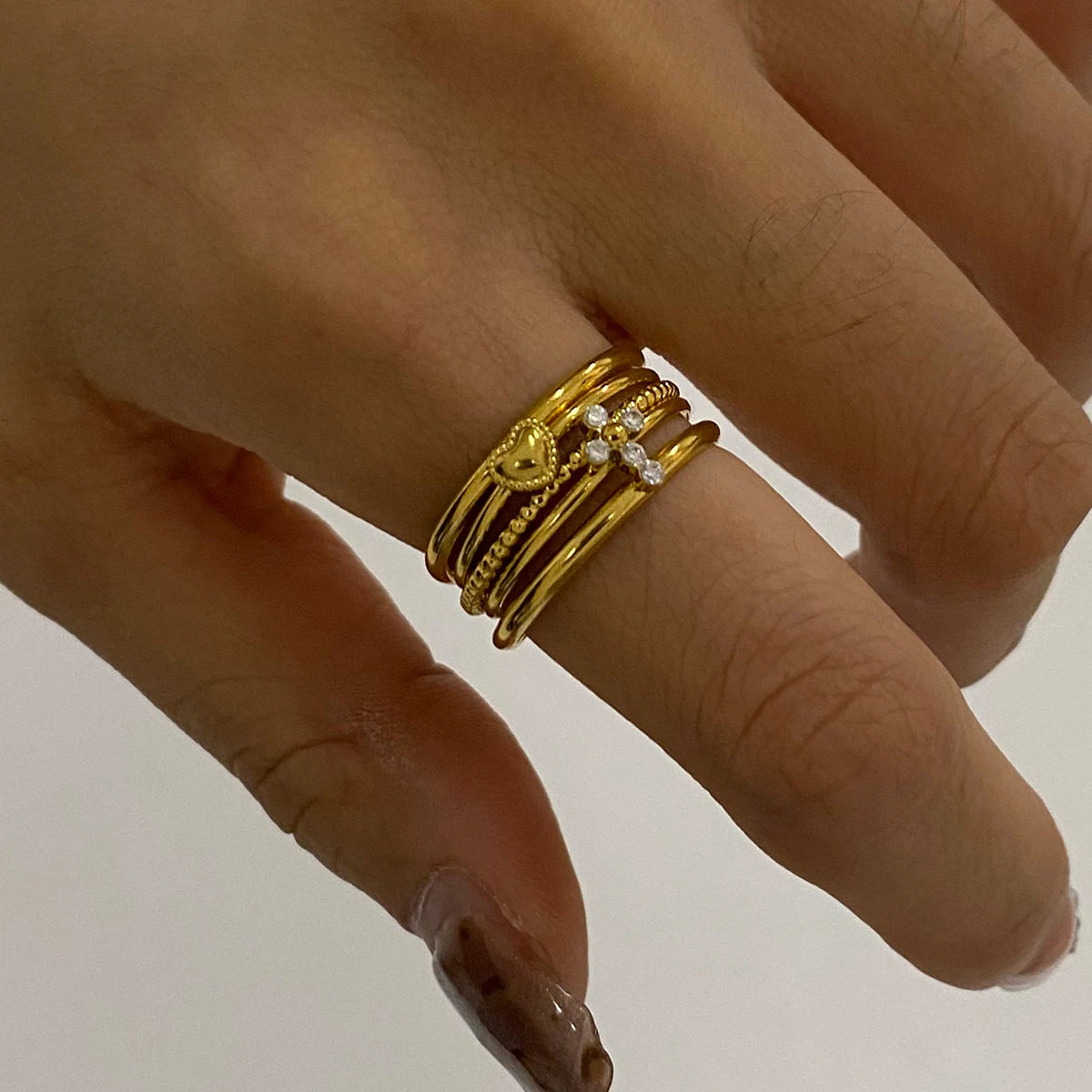 Minimalist 3-Piece Ring Set . Stainless Steel Stackable Rings with Zircon Accents and Ribbed Flower Detail for Effortless Style