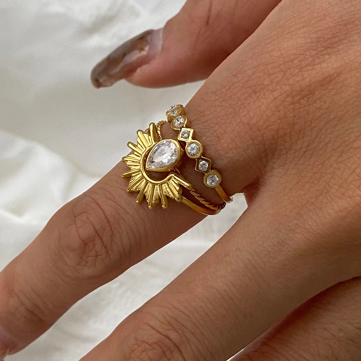 Minimalist 3-Piece Ring Set . Stainless Steel Stackable Rings with Zircon Accents and Ribbed Flower Detail for Effortless Style