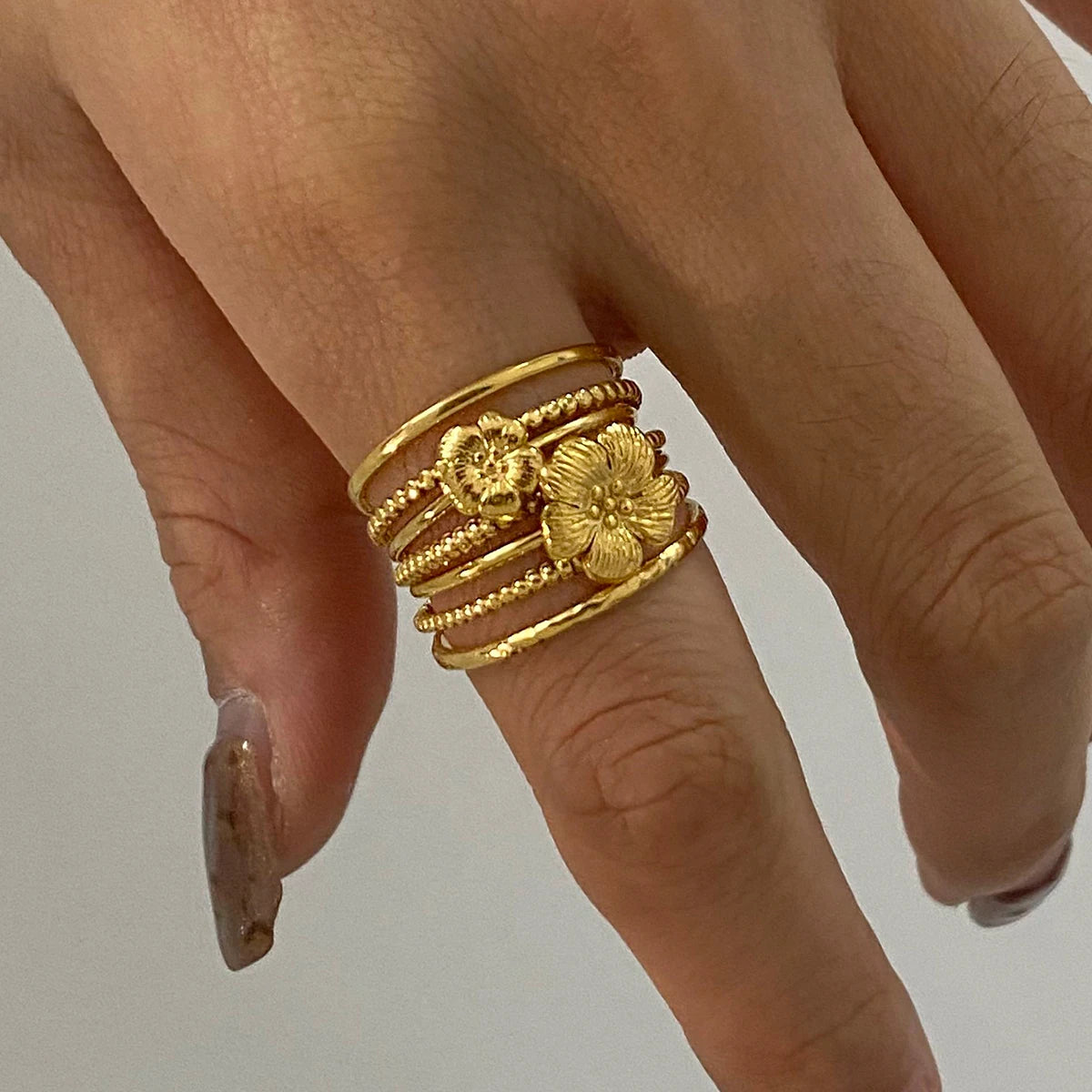 Minimalist 3-Piece Ring Set . Stainless Steel Stackable Rings with Zircon Accents and Ribbed Flower Detail for Effortless Style