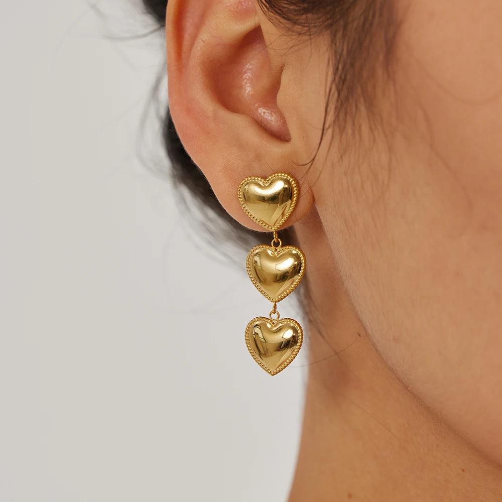 Elegant Double Heart Drop Earrings . 18K Gold Plated Stainless Steel with Smooth Titanium Finish, A Timeless Symbol of Love & Sophistication