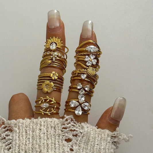 Minimalist 3-Piece Ring Set . Stainless Steel Stackable Rings with Zircon Accents and Ribbed Flower Detail for Effortless Style